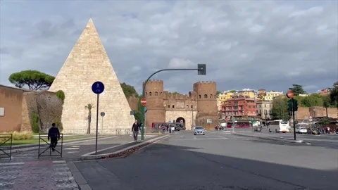 Pyramid of Caius Cestius and small castle on the streets of Italy. Stock Footage 257637454