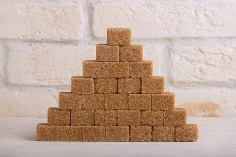 Pyramid of cane sugar in the form of cubes Stock Photos