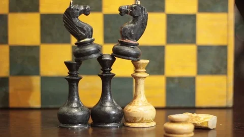THE PYRAMID OF THE CHESS PIECES IS CRUMBLING UNDER THE ONSLAUGHT Stock Footage 74884489