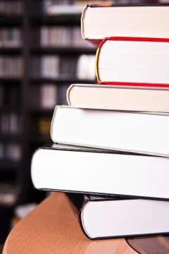 Pyramid of hefty big volumes on the table Stock Photos