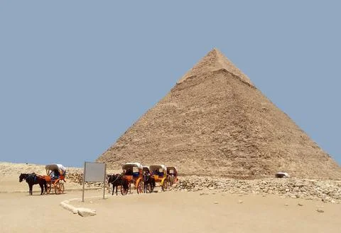 Pyramid of Khafre and a string of chariots on the Giza plateau in August 2021 Stock Photos