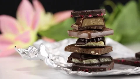 Pyramid of pieces of dark chocolate Stock Footage 125013205