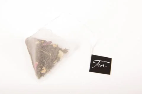 Pyramid shape teabag on the white background Stock Photos