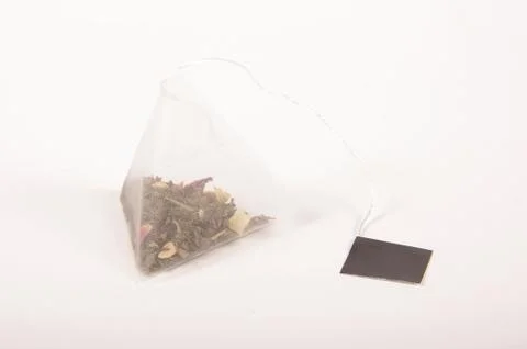 Pyramid shape teabag on the white background Foto stock