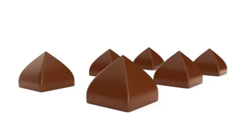 Pyramid shaped chocolate candy on White background. Exclusive molded bonbon.. Ilustración de archivo
