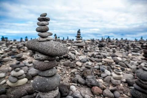 Pyramid of the small pebbles on the beach. Stock Photos