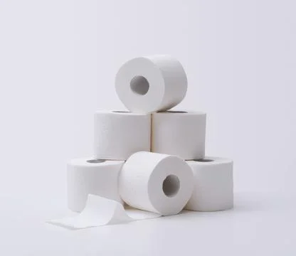 Pyramid Stack of White Toilet Paper Rolls representing Household Hygiene Es.. Stock Photos