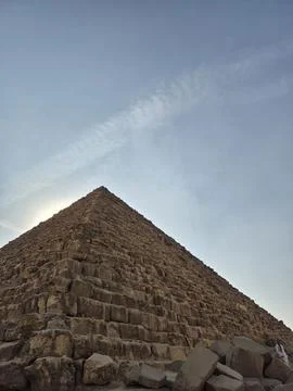 Pyramid stone blocks close-up from low angle with the apex against a blue s.. Stock Photos