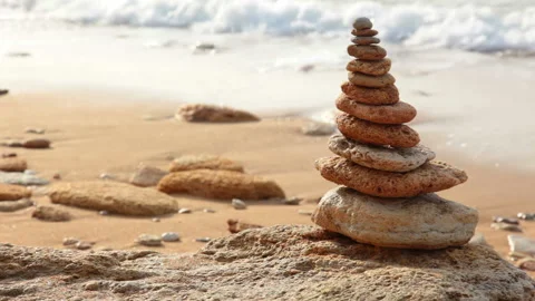 Pyramid of Stones on the Background of the Surf 動画素材 106459515
