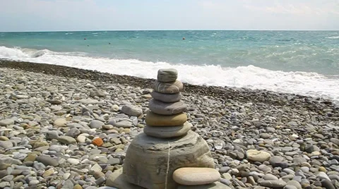 The pyramid of stones is on the beach Stock Footage 28339190