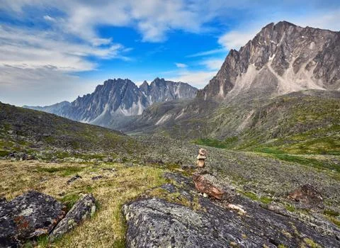 Pyramid of stones - a pointer to the path in the mountain tundra Stock Photos