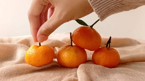 A pyramid of three fresh oranges  Stock Footage 146259844