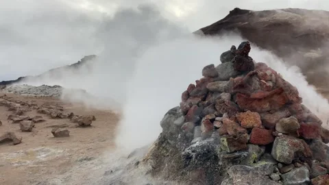 Pyramid of volcanic rocks emanating sulfur steam at Hverir volcanic area, Stock Footage 256653858