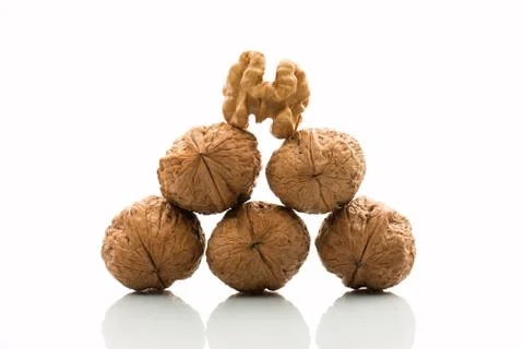 Pyramid of walnuts Stock Photos