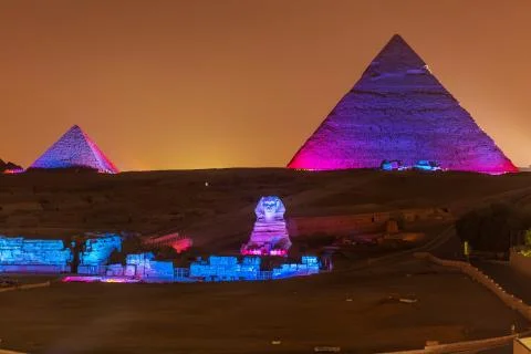 The Pyramids and the Sphinx in the night lights, Giza, Egypt Stock Photos