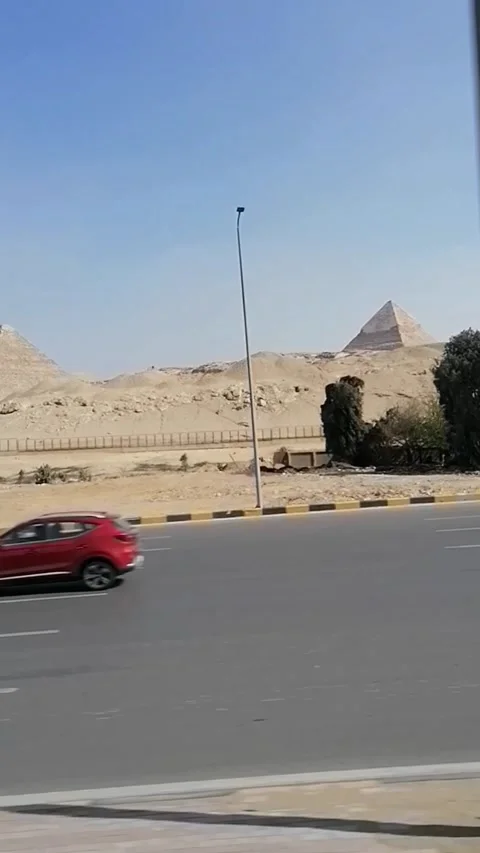 The Pyramids of Egypt are seen at a Distance Footage Video stock 248003426