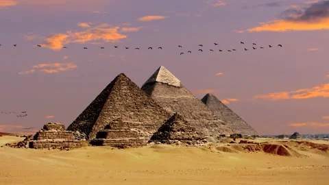 Pyramids in egypt, desert, sand - clouds at sunrise with birds - real time 스톡 동영상 147451642