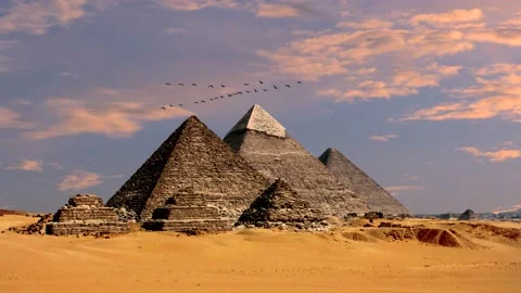 Pyramids in egypt, desert, sand - clouds at sunrise, flying birds - real time Stock Footage 147452078