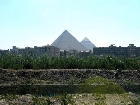 Pyramids of Giza Rise Majestically Above Cairo's Skyline in the Desert Sunlig Stock Photos