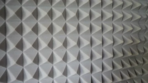 Pyramids of soundproof foam close-up. Noise suppression tool. Gray acoustic foam Stock Footage 171407959