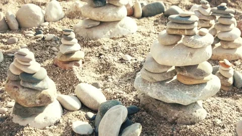 Pyramids of stone on the beach Stock Footage 87213229