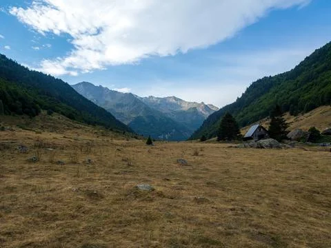 Pyrenees mountain valley with a remote mountain cabin Stock Photos