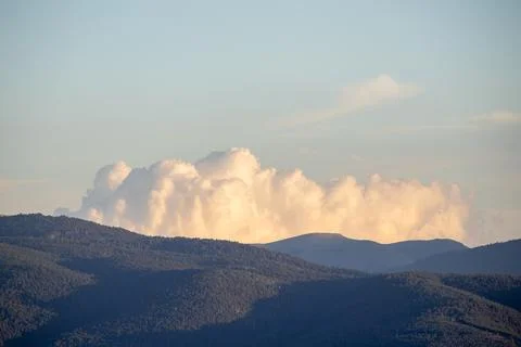 Pyrenees mountains with cumulus clouds at sunset Stock Photos