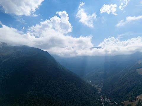 Pyrenees mountains valley with clouds and sunrays Stock Photos