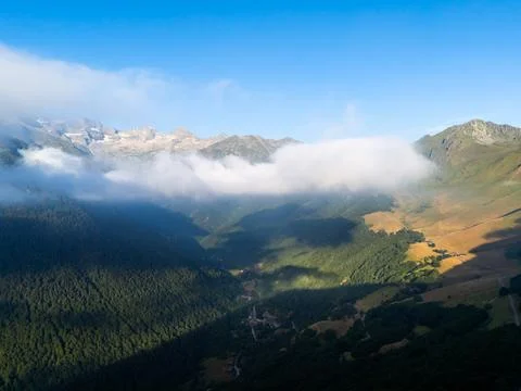 Pyrenees mountains valley with clouds and morning light Stock Photos