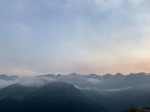 Pyrenees mountains valley with clouds at sunset Stock Photos