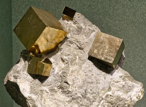 Pyrite cubes embedded in a matrix Stock Photos