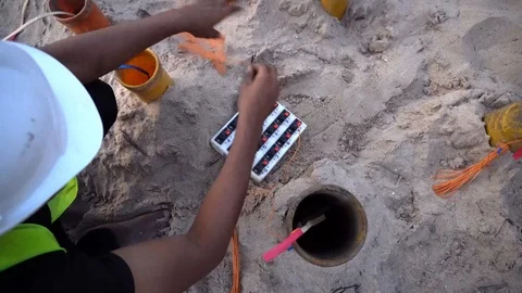 A pyrotechnic expert working on the field Stock Footage 98043178