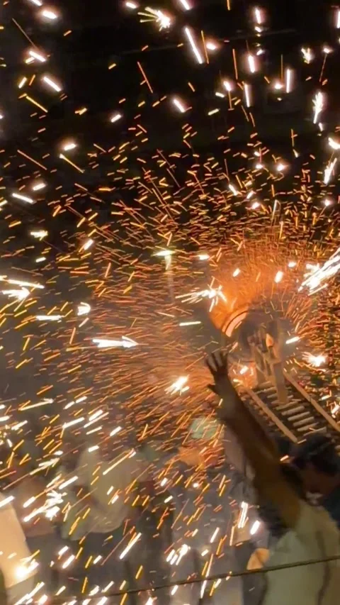 Pyrotechnic fire bull spinning massive sparks display during Spanish fiesta Stock Footage 341153294