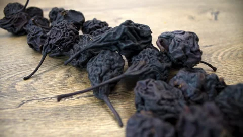 Pyrus communis: Tracking Shot of Whole Dried Fruits Stock Footage 332857750