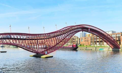 Python bridge The modern red Python bridge in Amsterdam, Netherlands. Copy... 写真素材