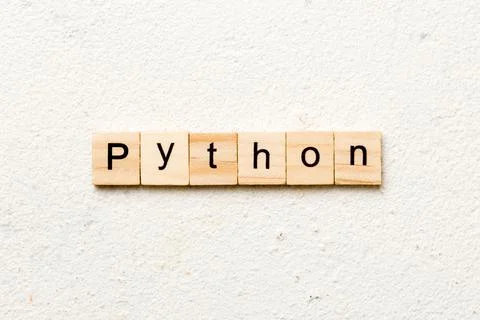 Python word written on wood block. python text on table, concept Photos