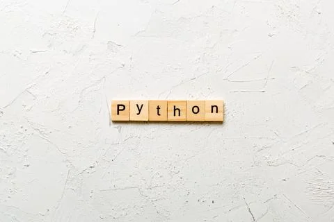 Python word written on wood block. python text on table, concept 写真素材