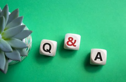 Q and A - Question and Answer. Wooden cubes with words Q and A. Beautiful g.. Stock Photos