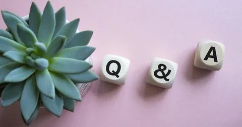 Q and A - Question and Answer. Wooden cubes with words Q and A. Beautiful p.. Stock Photos