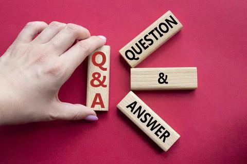 Q and A - Question and Answer. Wooden cubes with words Q and A. Businessman.. Stock Photos
