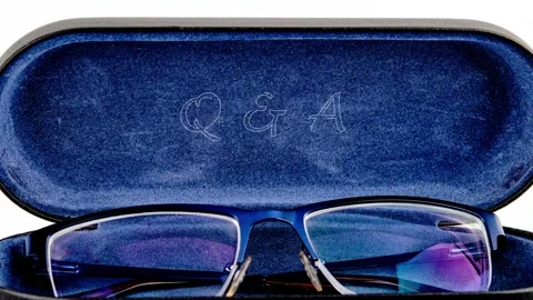 Q and A symbol Question and Answer animates on the open lid of the eyeglass case Stock Footage 318627131