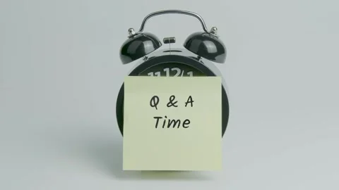 Q and A Time Text or Word on Yellow Note Paper Sticking onto Black Clock Stock Footage 300157279