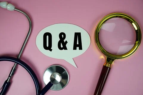 Q&amp;A (Question and Answer) text with stethoscope and magnifying glass on pin.. Stock Photos