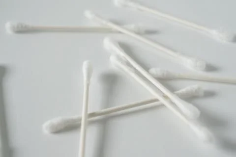 Q-tip, or cotton bud swab top view on white background with blank empty space Stock Photos