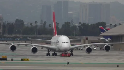 Qantas A380 Passenger Jet Being Pulled by an Aircraft Tug Stock Footage 248586445