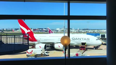 Qantas airbus a380 parked at airport gate being prepared for takeoff Stock Footage 295942672