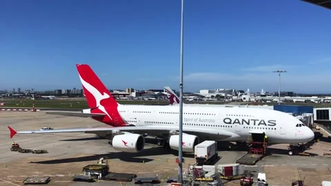 Qantas airbus a380 parked at airport gate being prepared for takeoff Stock Footage 295943227