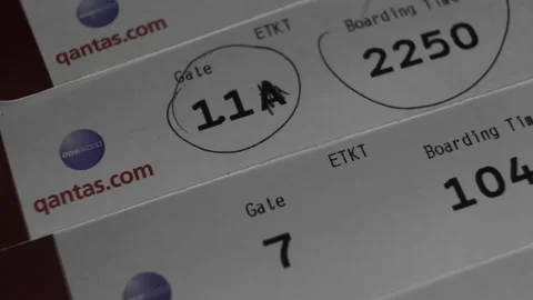 Qantas Airways Boarding Tickets With Gate And Time Information. Close Up, Stock Footage 154477556