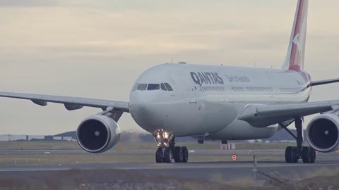 Qantas commercial passenger Airplane Taxi on runway Stock Footage 81891072