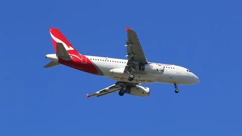 Qantas link flight coming into land at Perth airport, wheels down close up shot Stock Footage 328080936